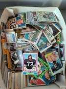 Football, baseball, and basketball trading cards with extra binder sleeves