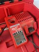 Milwaukee pack out and tool box with drill, impact, battery and charger