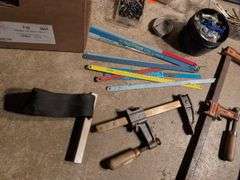 Miscellaneous tools and hardware - gas can, clamps, scythe, railroad nails, hacksaw blades, and more