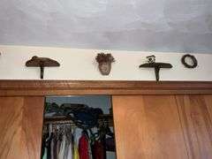 WOODEN SHELVES AND RUSTIC DECOR ON WALL