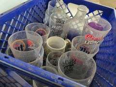 Bar glasses with sports logos in (2) milk crates