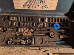 Metal toolboxes with wrenches and sockets
