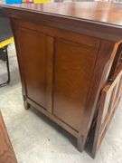 Wooden TV stand with glass doors