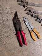 (5) adjustable wrenches, wire stripper, and metal snips