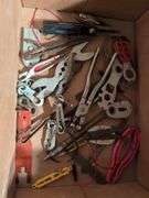 Miscellaneous tools and hardware - gas can, clamps, scythe, railroad nails, hacksaw blades, and more