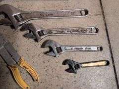 (5) adjustable wrenches, wire stripper, and metal snips