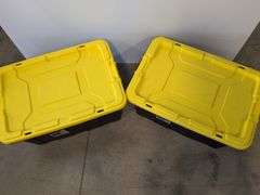 (2) black Sterilite industrial storage containers with yellow lids and handles