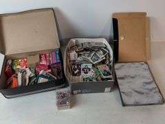 Football, baseball, and basketball trading cards with extra binder sleeves