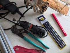 Black and Decker drill, Dremel and accessories, saw, staple gun, other tools, and model airplane
