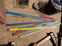 Miscellaneous tools and hardware - gas can, clamps, scythe, railroad nails, hacksaw blades, and more