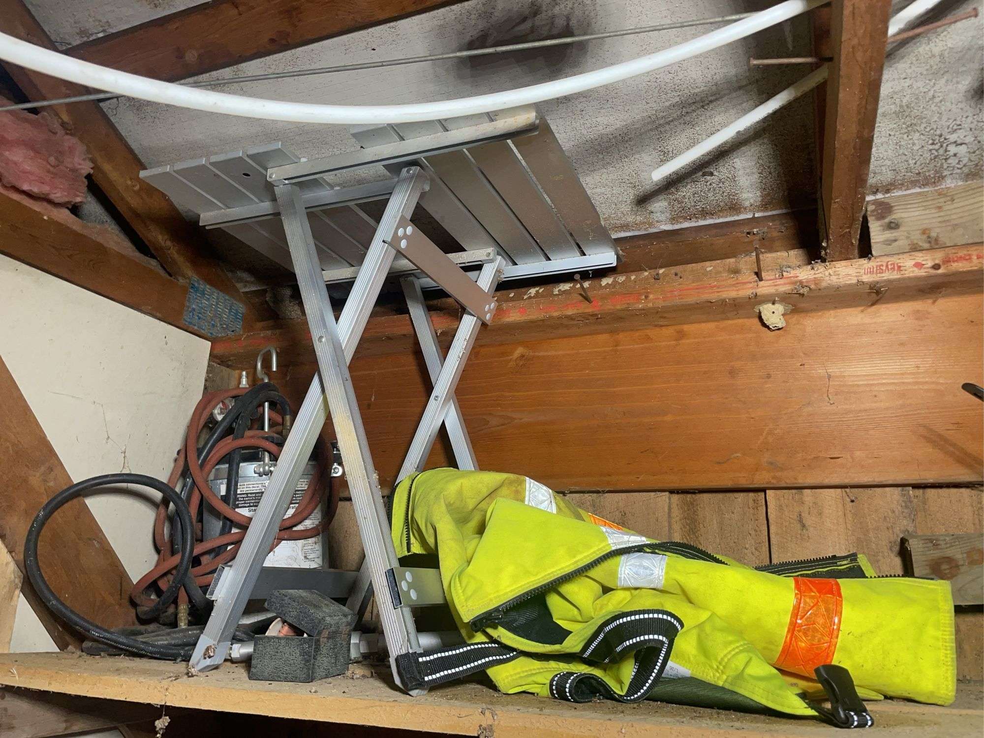 Reflective vest, paint sprayer, construction stand