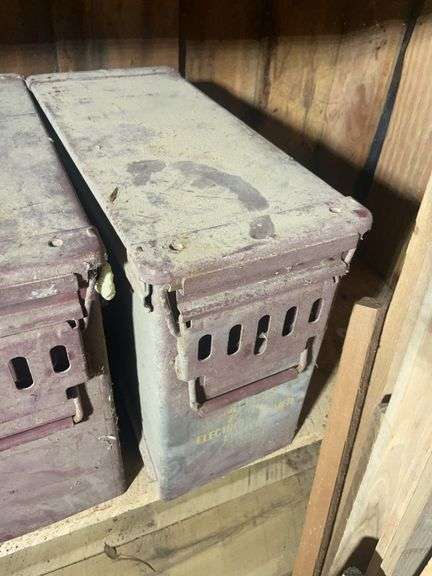 Assortment of ammo boxes and military shovels