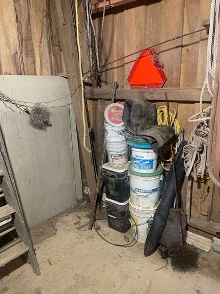 Contents of corner including buckets, roping, scrap wood and more