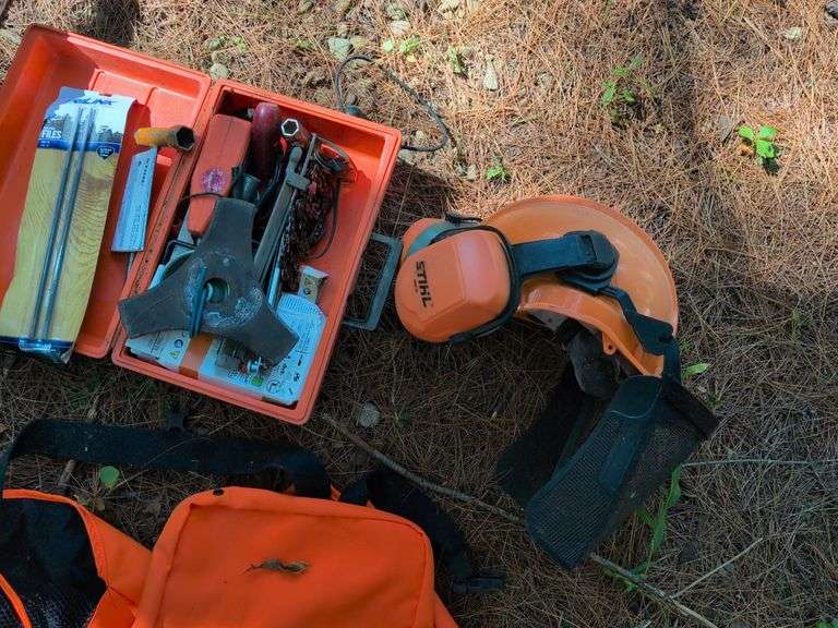 Stihl MS 201C chainsaw, protective helmet, and extra chains