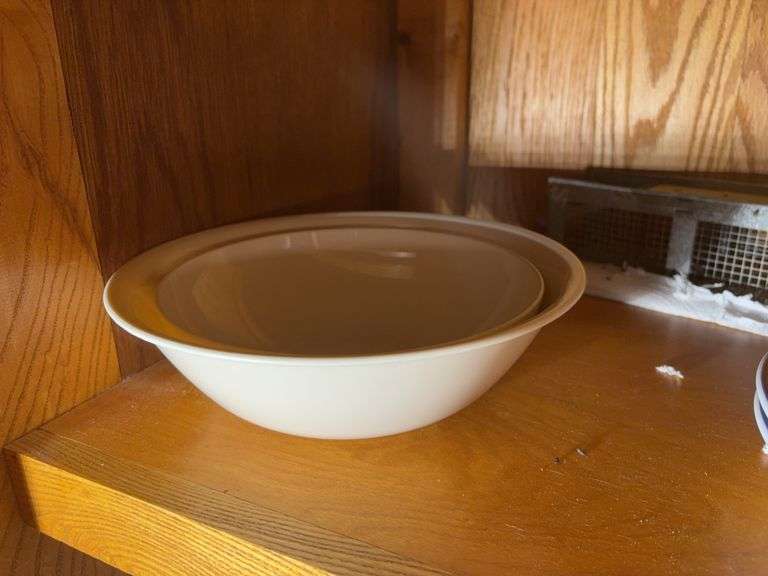 (2) shelves of stainless steel mixing bowls, cake pans, cupcake pan, loaf pans, and more