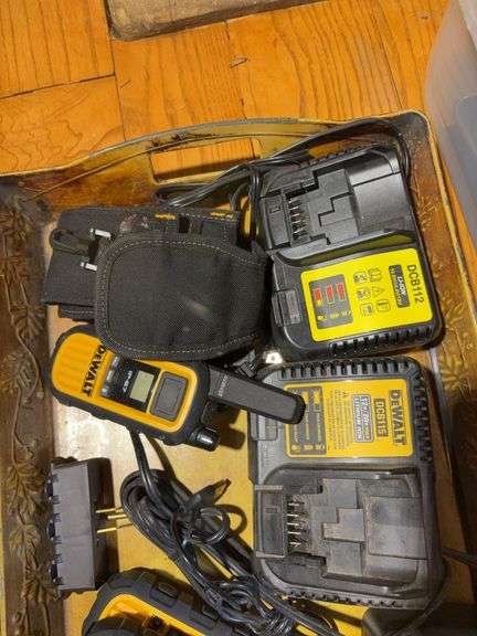 Totes with DeWalt walkie talkies, battery chargers, gloves, tape gun, and other items