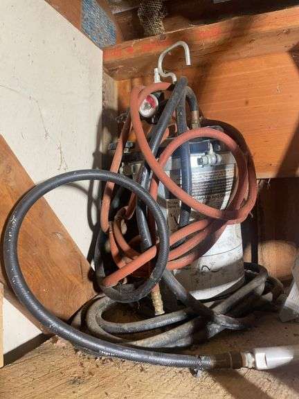 Reflective vest, paint sprayer, construction stand