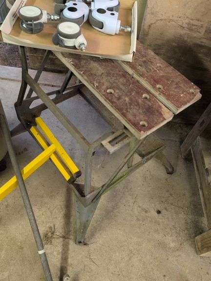 Trash barrel with piping, work stand, conduit bender, and roller