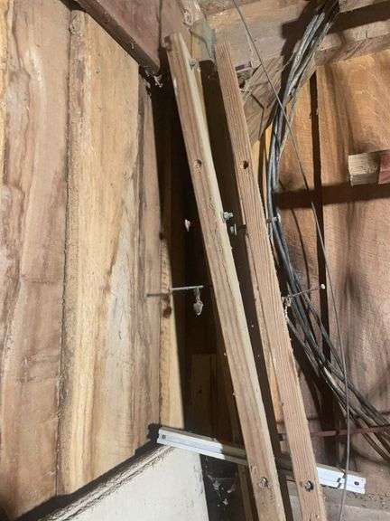 Contents of corner including buckets, roping, scrap wood and more