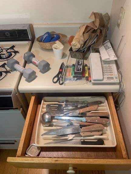 Cooking utensils, dumbbells, and other items