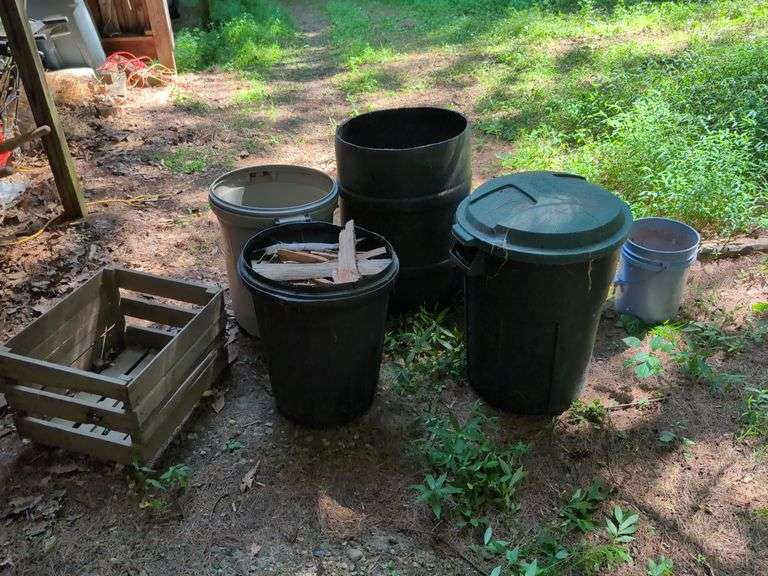 Trash barrels, bucket, crate, and 55 gallon drum