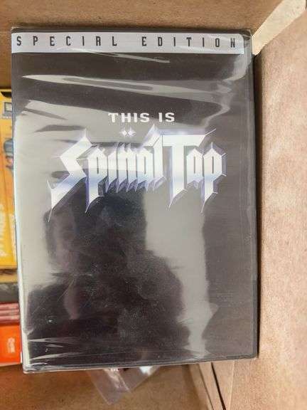 Box of VCR Tapes and DVDs
