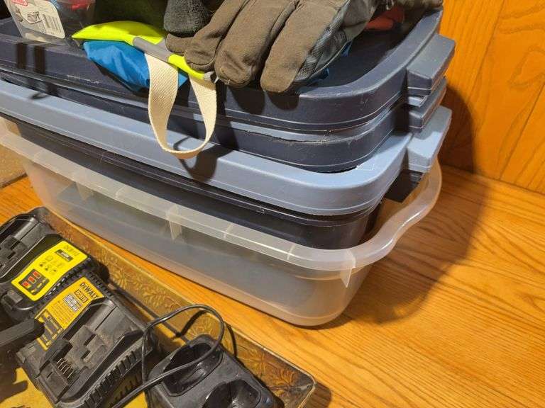 Totes with DeWalt walkie talkies, battery chargers, gloves, tape gun, and other items