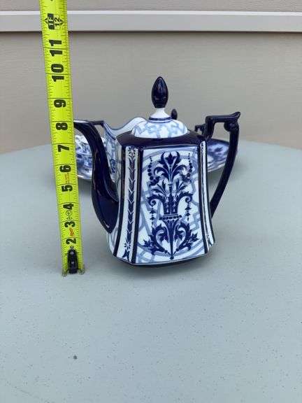 Blue and White Patterned Tea Pot w/ Sugar and Creamer, (2) Tea Cups w/ (2) Plates, and Serving Dish