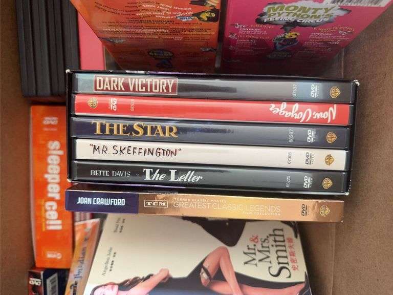Box of VCR Tapes and DVDs