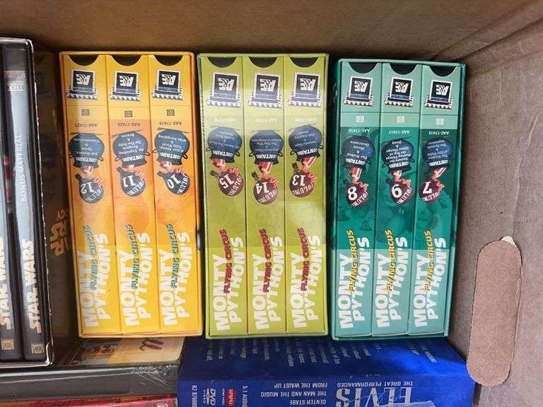 Box of VCR Tapes and DVDs