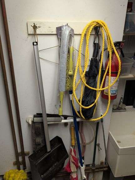Contents of corner - dehumidifier, hard hat, cleaning items, and more
