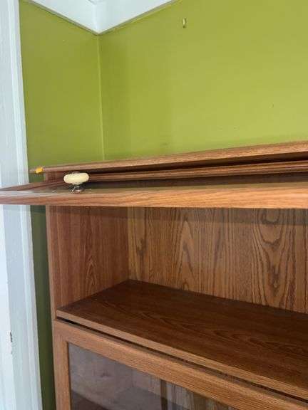 Unmarked Wooden Bookcase with Glass Doors