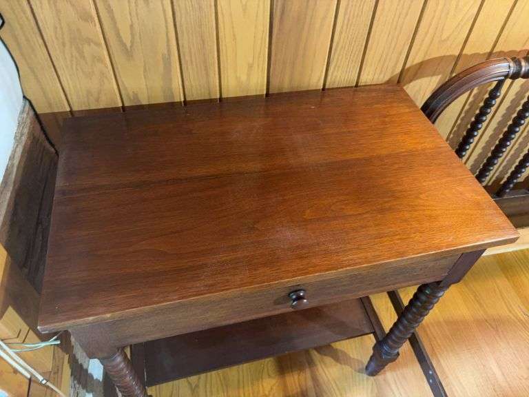 Twin bed frame with matching nightstand and comforter