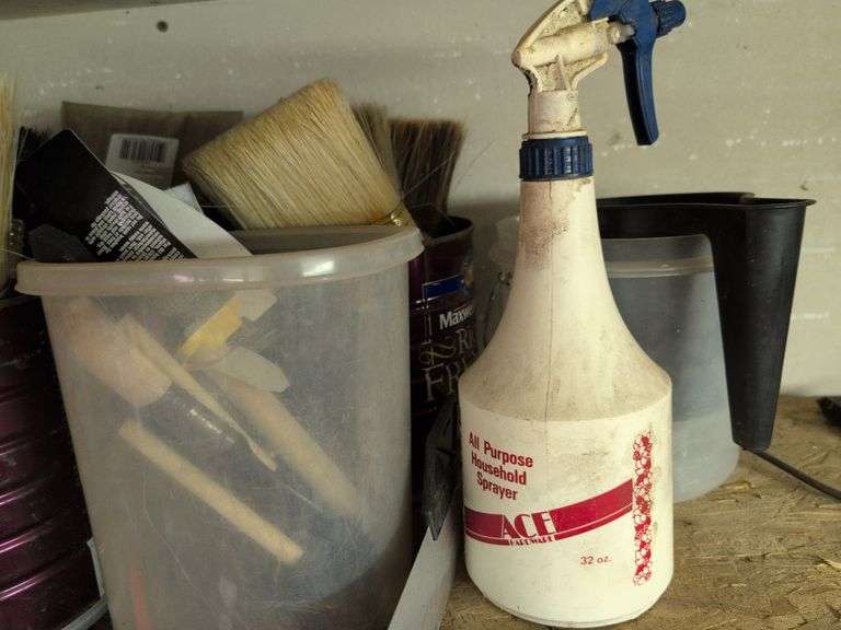 Contents of shelf - staple guns, tape, paint brushes, and more