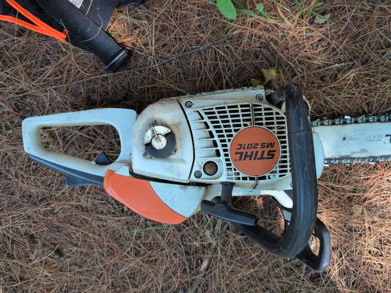 Stihl MS 201C chainsaw, protective helmet, and extra chains