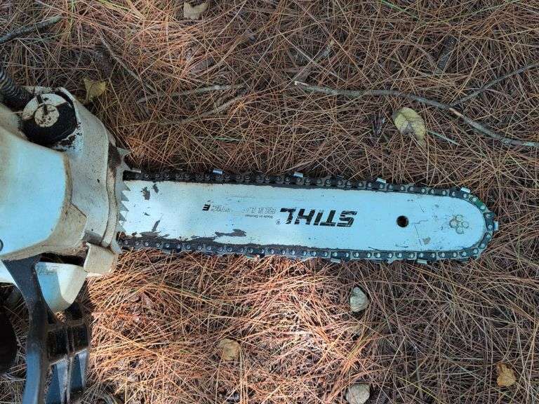 Stihl MS 201C chainsaw, protective helmet, and extra chains