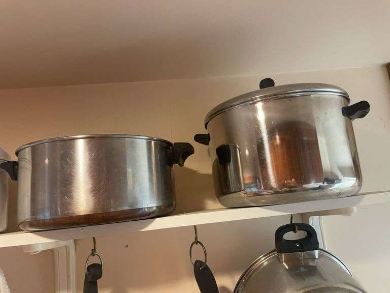 Lot of pots and pans including Farberware and revereware