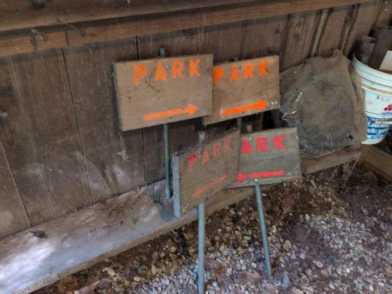 Contents of corner - live animal traps, milk crates, battery charger, and signs