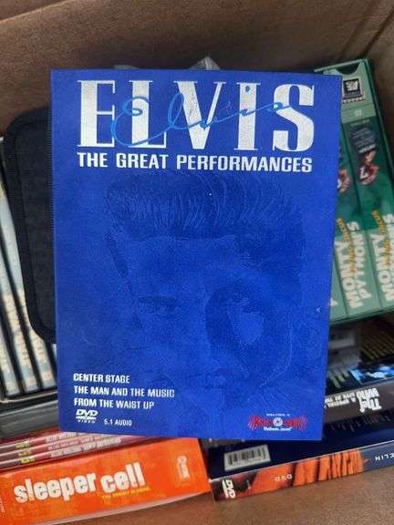 Box of VCR Tapes and DVDs