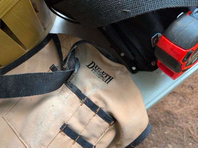 (2) tool belts with tools, extension cords, and other items