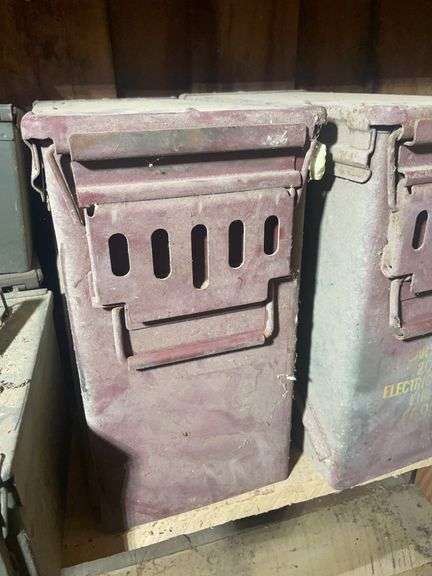 Assortment of ammo boxes and military shovels