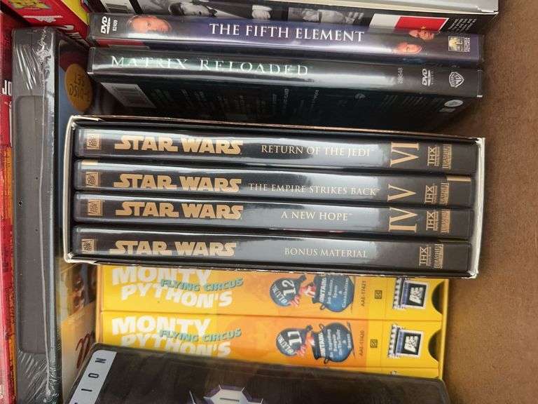 Box of VCR Tapes and DVDs