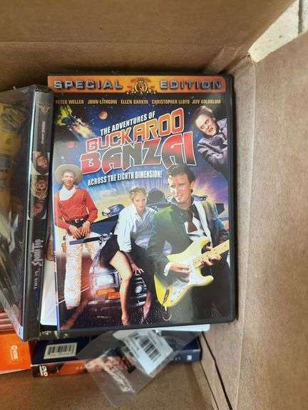 Box of VCR Tapes and DVDs