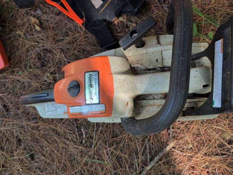 Stihl MS 201C chainsaw, protective helmet, and extra chains