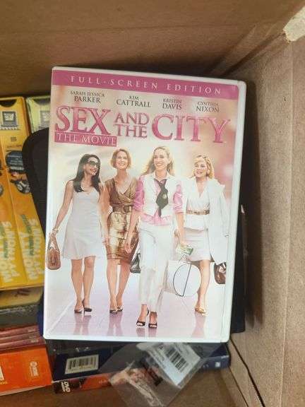 Box of VCR Tapes and DVDs