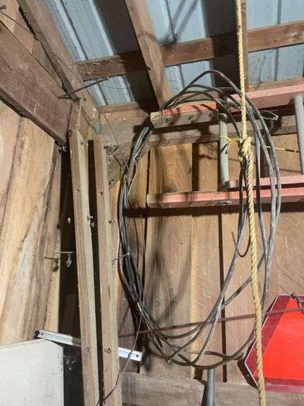 Contents of corner including buckets, roping, scrap wood and more