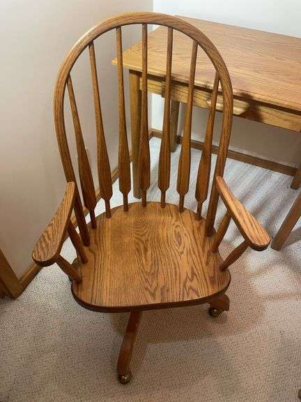 Wooden office desk, rolling chair, and stand