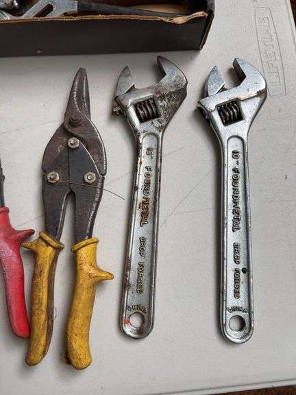 Flat of wrenches, pliers, snips, and other hand tools
