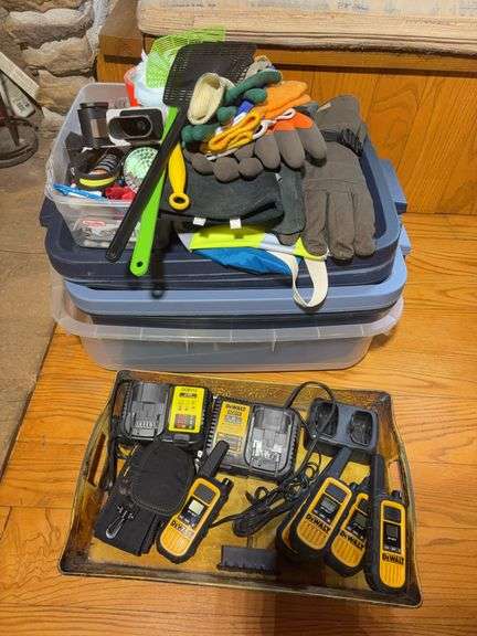 Totes with DeWalt walkie talkies, battery chargers, gloves, tape gun, and other items