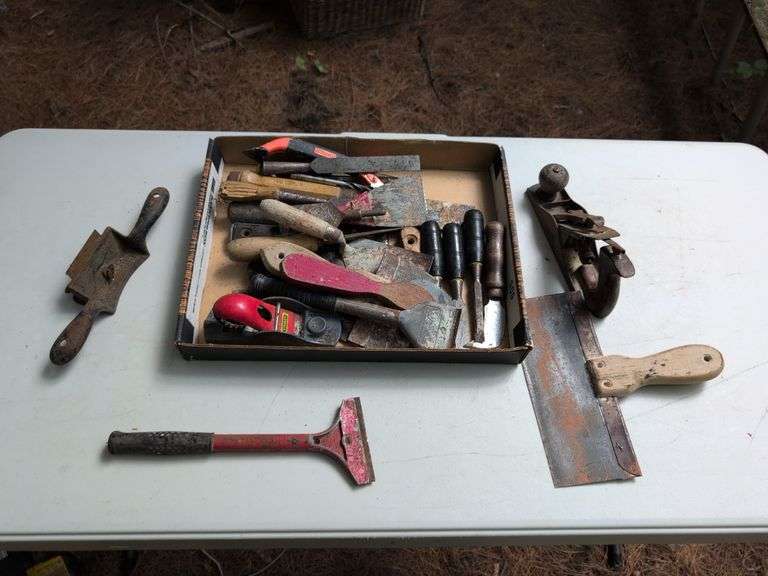 Flat of masonry tools, sander, chisels, and more